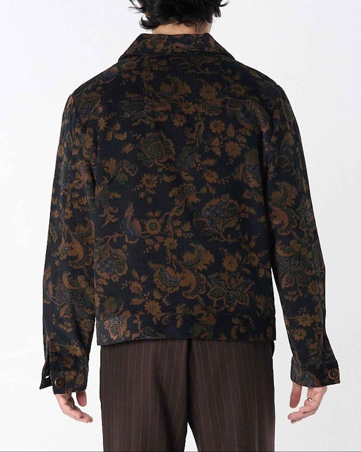 Dean Jacket in black and brown calico floral corduroy with relaxed boxy fit, shown on model in full-length view.