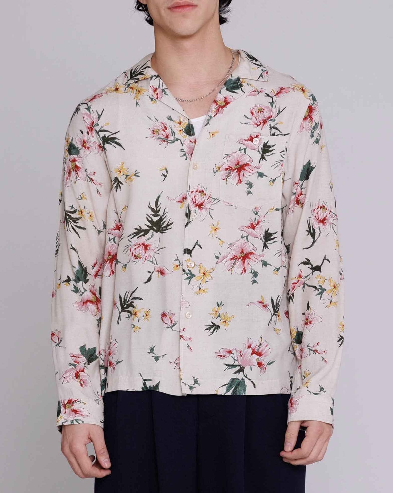 Reinaldo convertible-collar shirt in natural with red ukiyoe hibiscus print, relaxed fit rayon poplin, modeled on figure.
