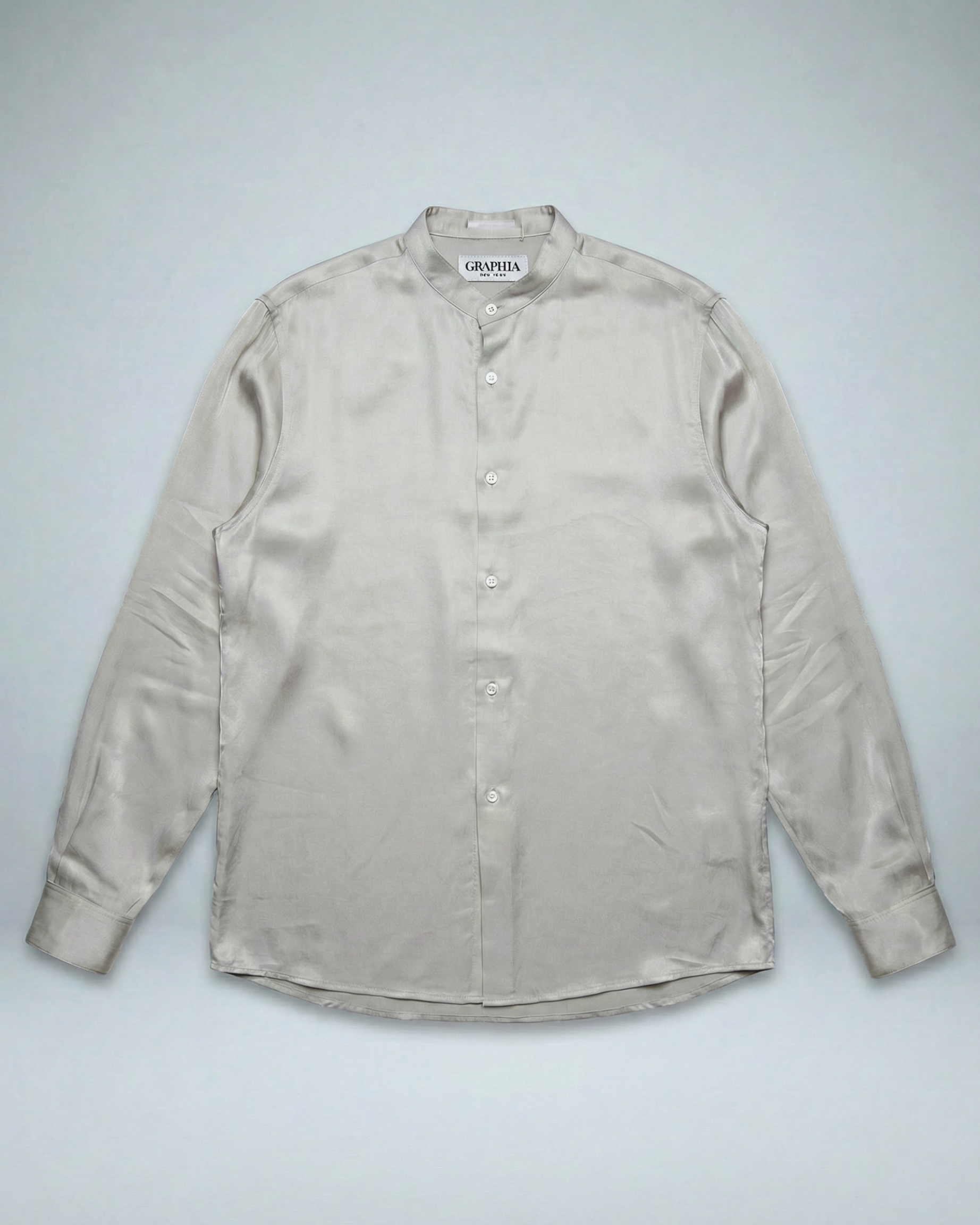 Liam band collar shirt in oyster taupe cupro twill, relaxed fit with button cuffs, worn untucked on model.
