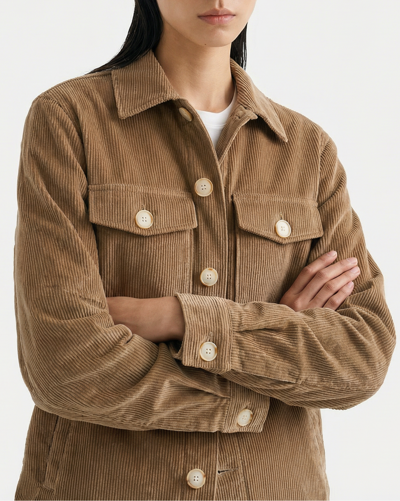 Model wearing fawn brown 8-wale corduroy Dean Jacket with relaxed boxy fit and dropped shoulders against white studio background