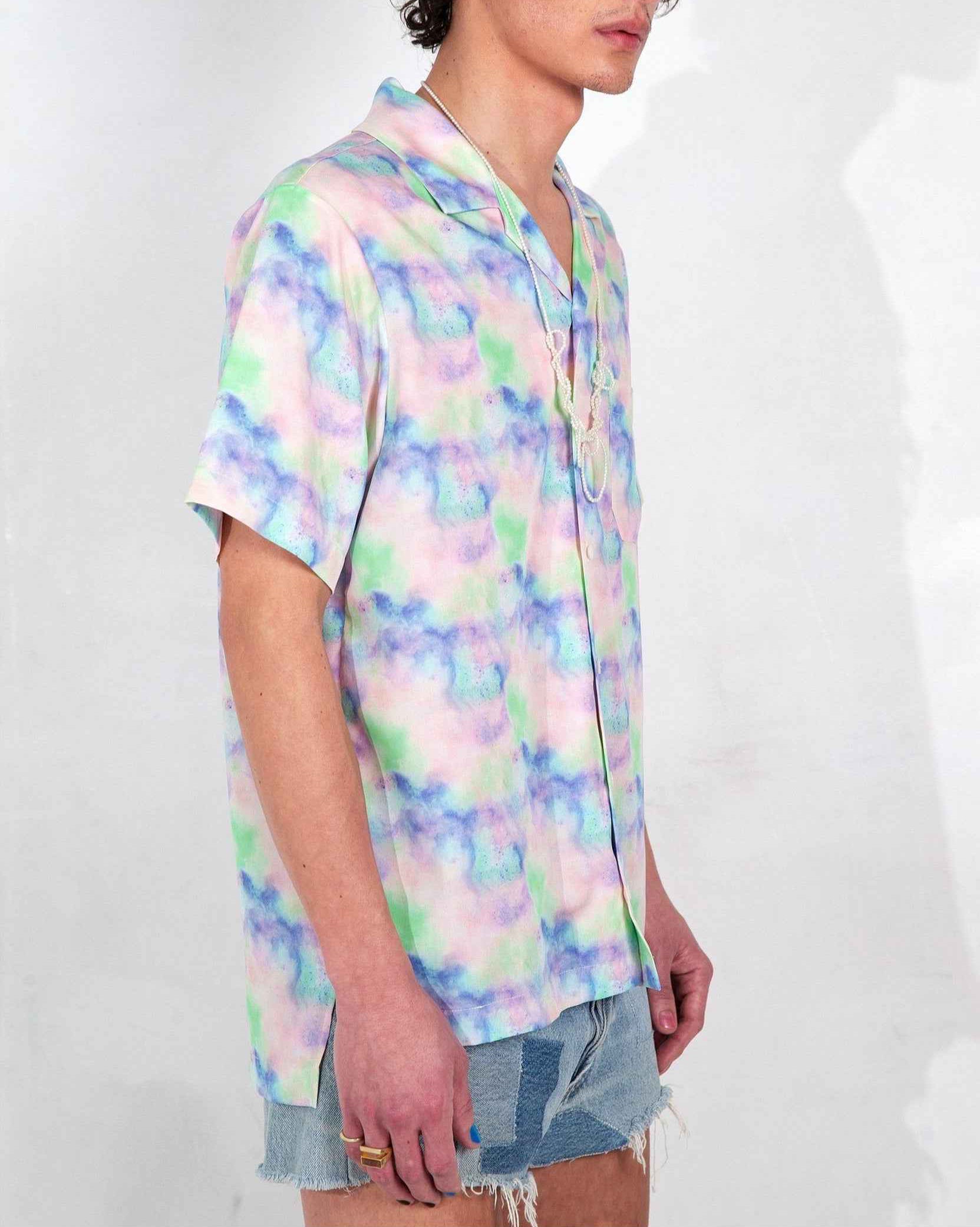 Desi camp collar shirt in Blue Dream Pop print worn untucked, relaxed resort fit, short sleeves, vibrant blue artistic print on lightweight cotton-Tencel blend.