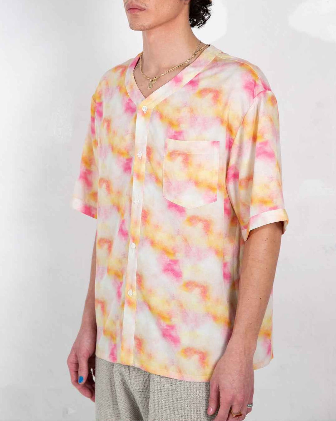 Valenzuela baseball collar shirt in red dream pop print, relaxed boxy fit with side slits, worn by model