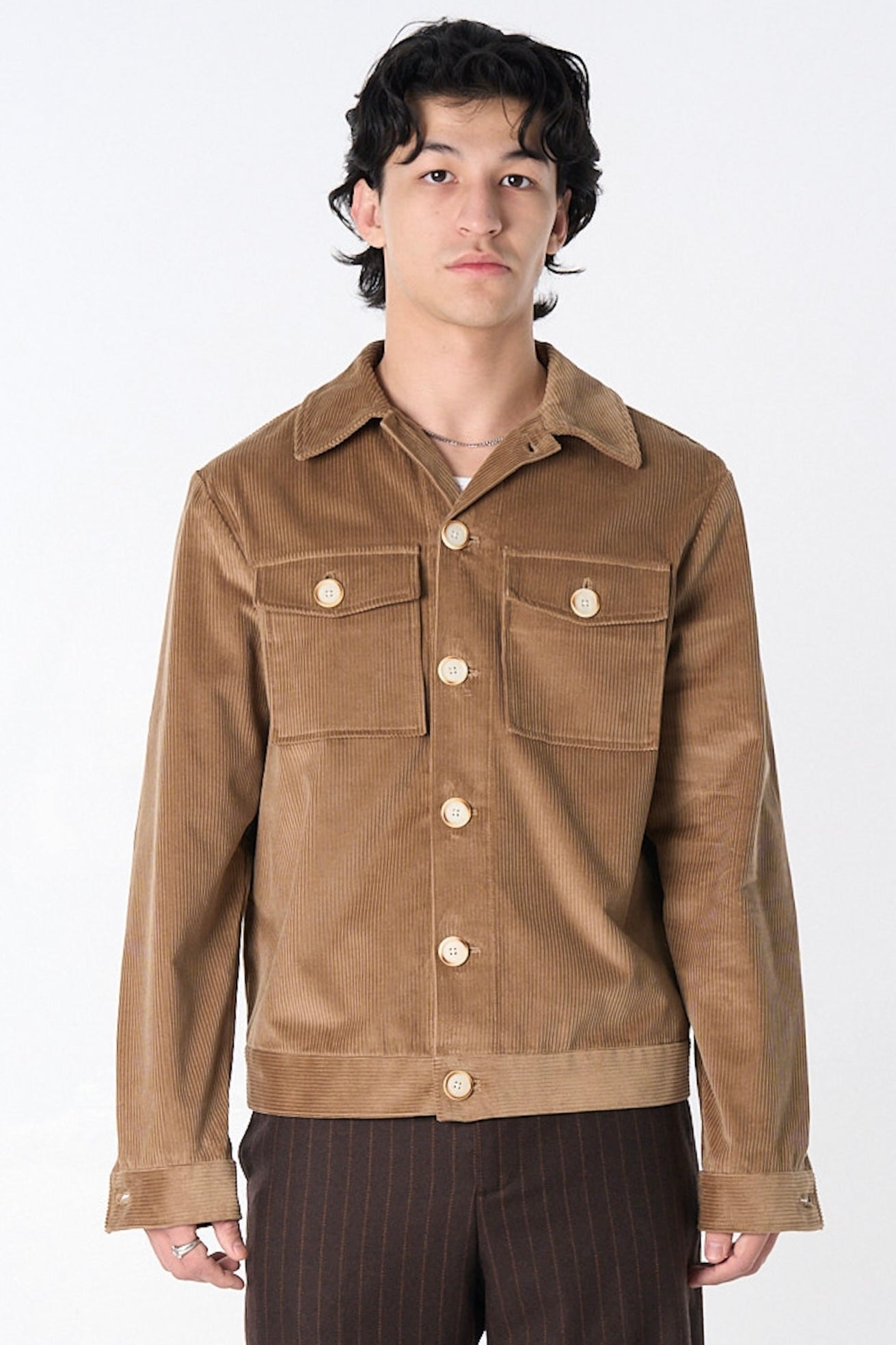 Light brown corduroy jacket with oversized contrast buttons.