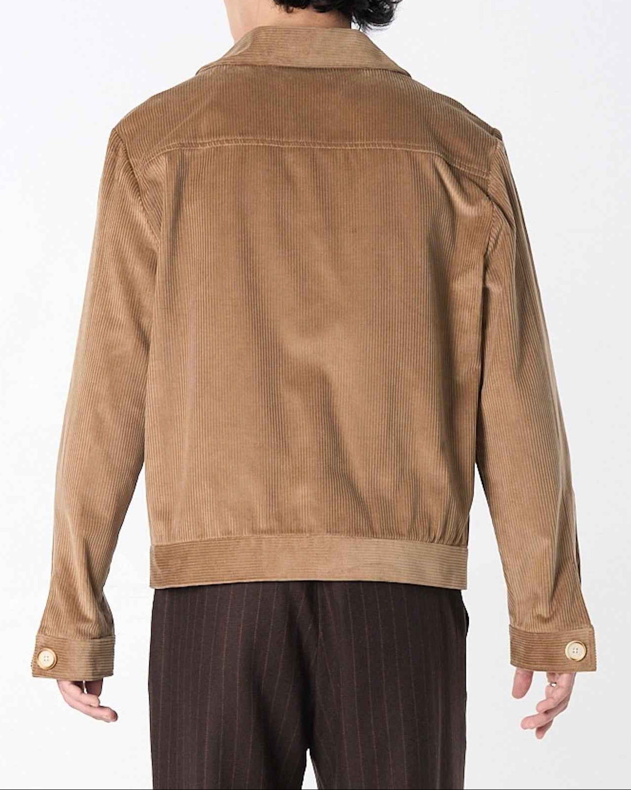 Dean Jacket in fawn brown 8-wale corduroy with relaxed boxy fit, shown on model in full-body stance displaying the hip-length silhouette and structured drape.