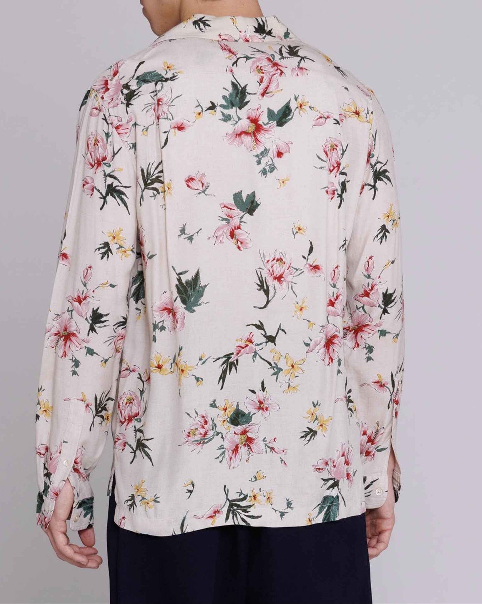 Reinaldo convertible-collar shirt in natural with red ukiyoe hibiscus print, relaxed fit rayon poplin, modeled on person.