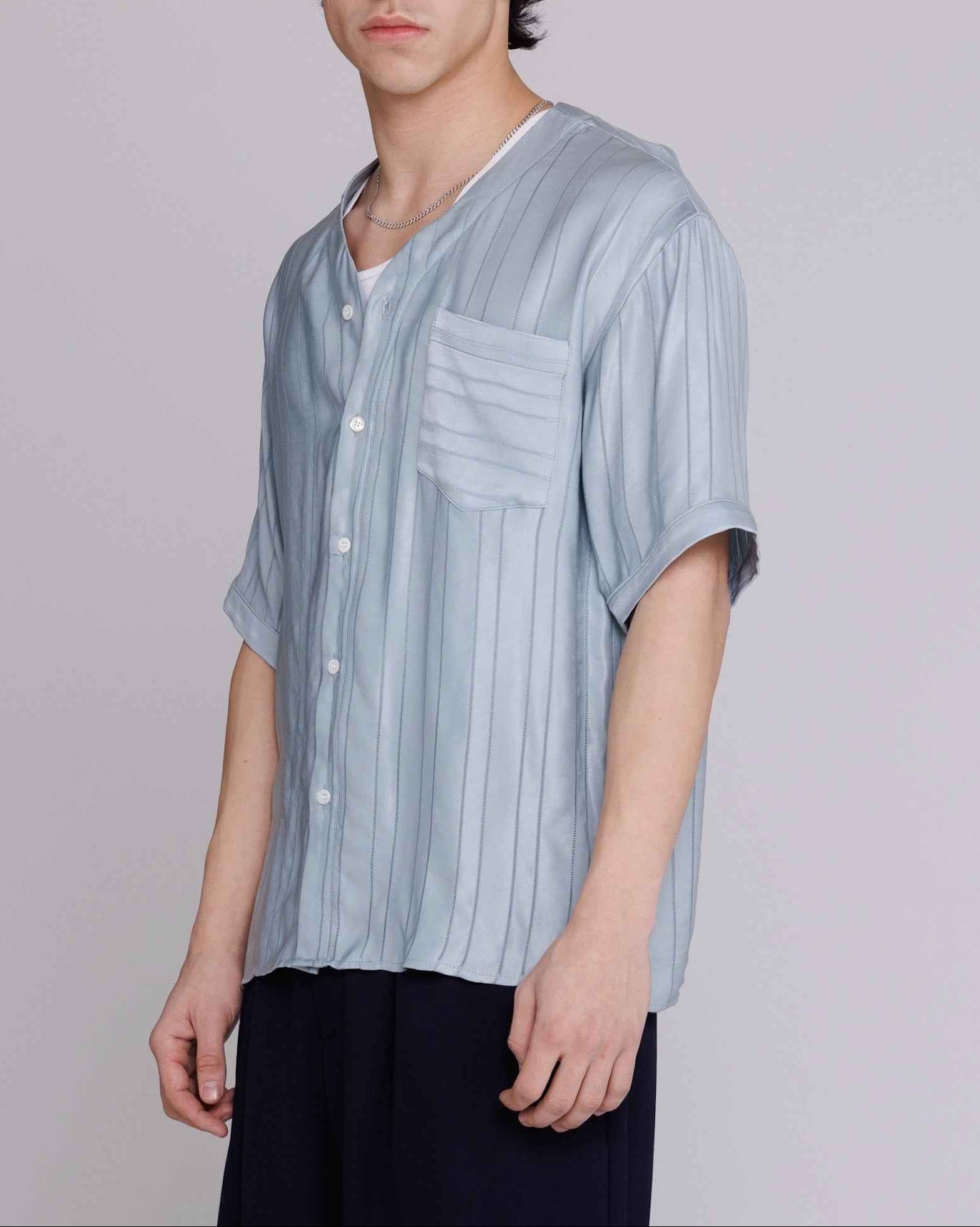 Valenzuela baseball collar shirt in blue satin stripe cupro georgette, relaxed fit, displayed on model in three-quarter view