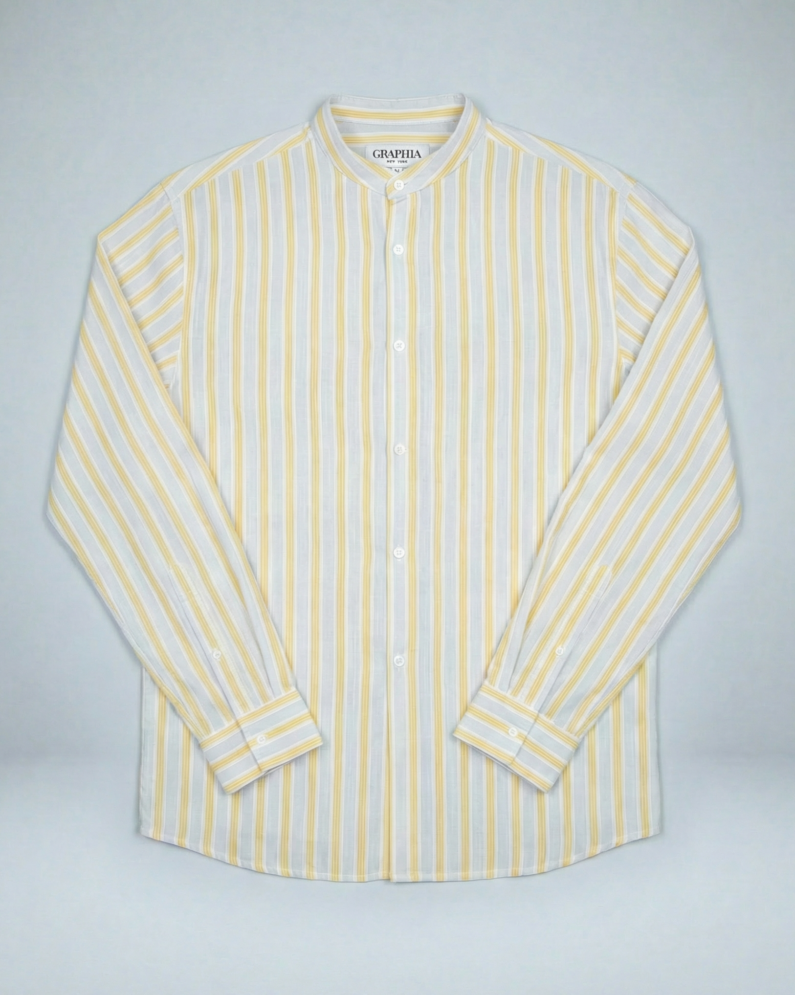Liam cream and yellow striped long sleeve shirt with band collar, displayed on model showing relaxed fit and textured slub cotton fabric.