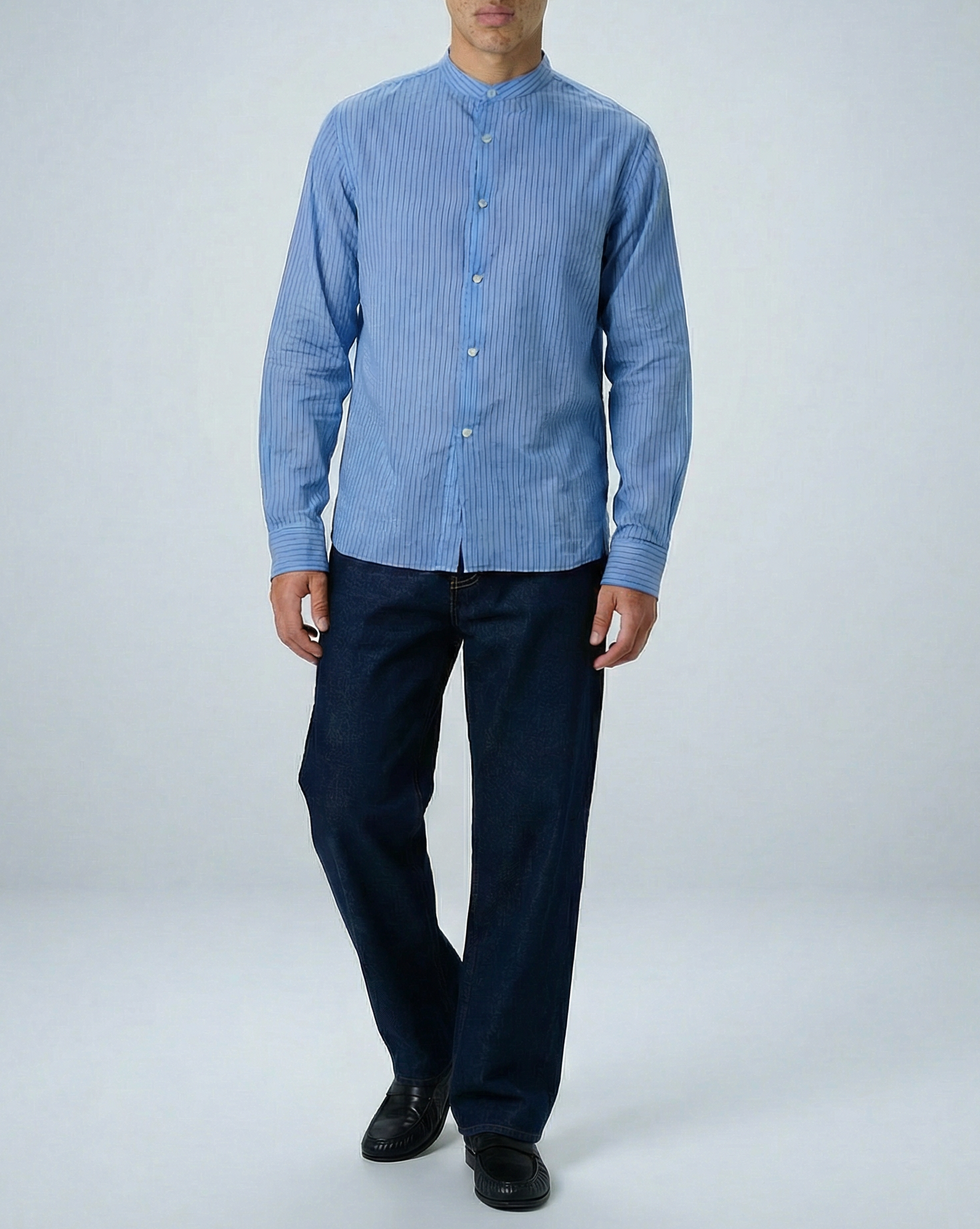 Liam band collar shirt in light blue and blue stripe, lightweight cotton voile with subtle crinkle texture, relaxed fit shown on model.