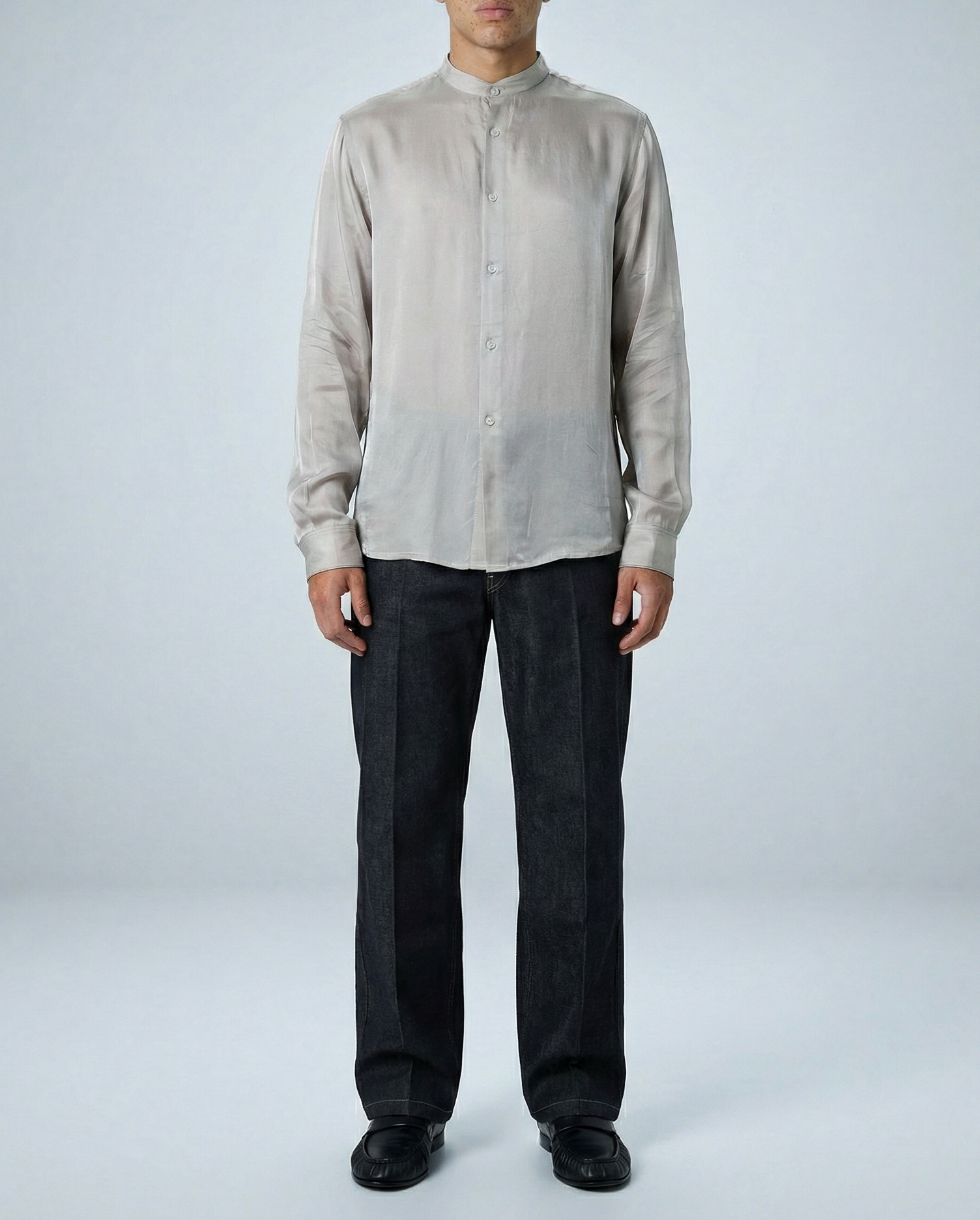 Liam band collar shirt in Oyster Taupe worn untucked by model facing forward, hands at sides, showcasing relaxed fit and silky cupro fabric.