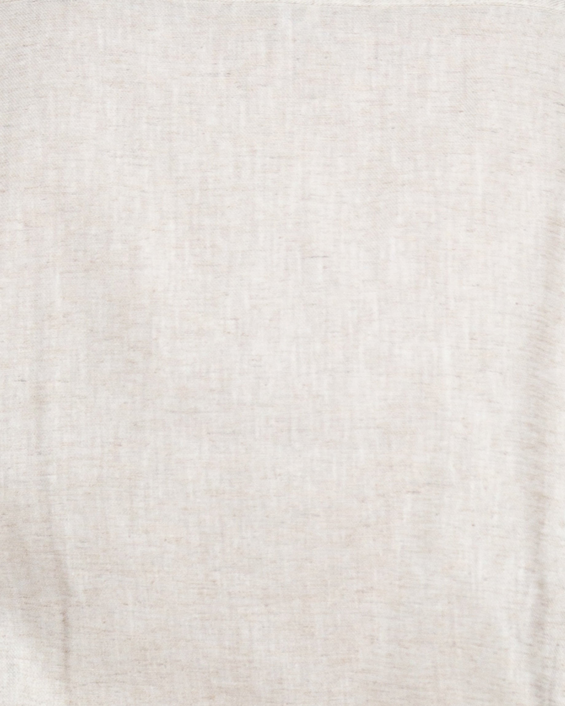 Liam band collar shirt in vintage cream linen cotton, relaxed fit, shown on model with long sleeves and button cuffs.