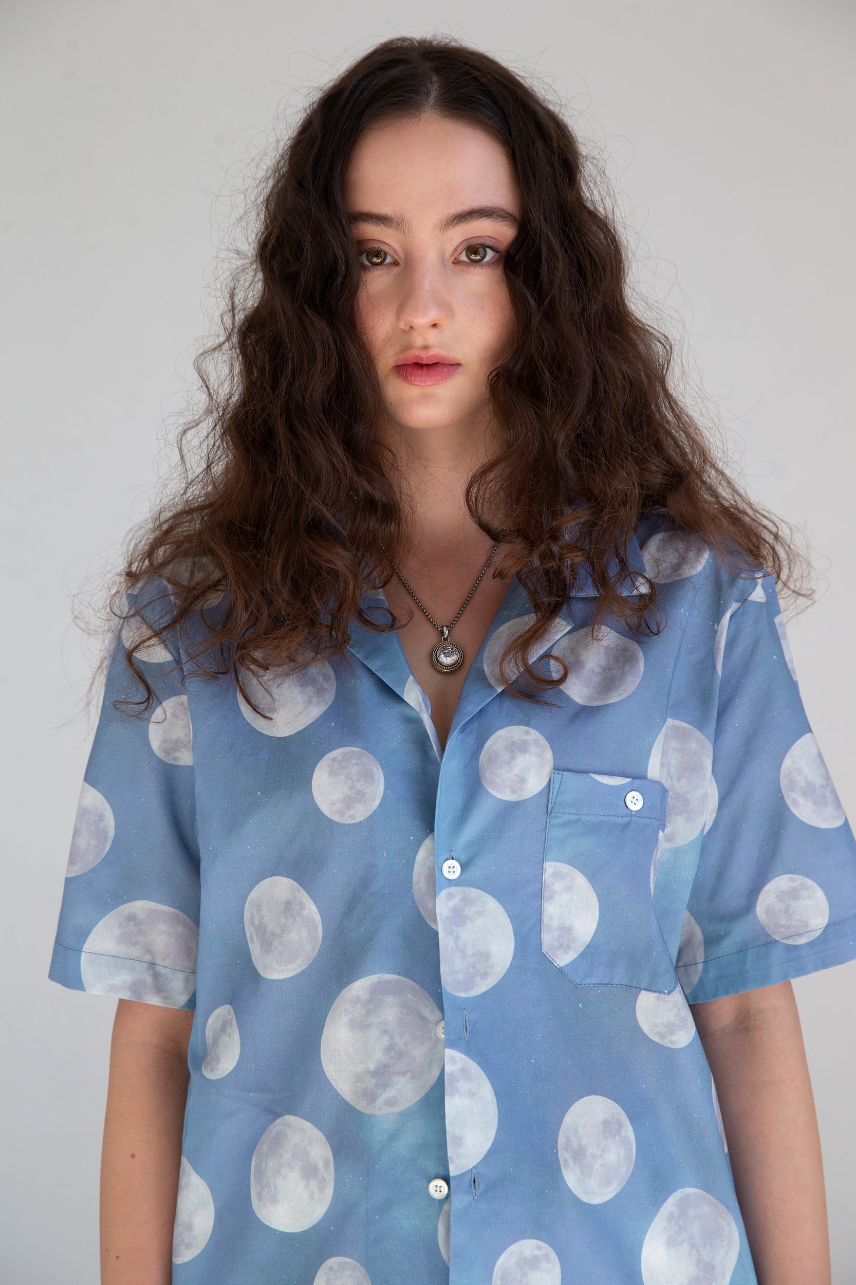 close up of light blue casual shirt on a woman