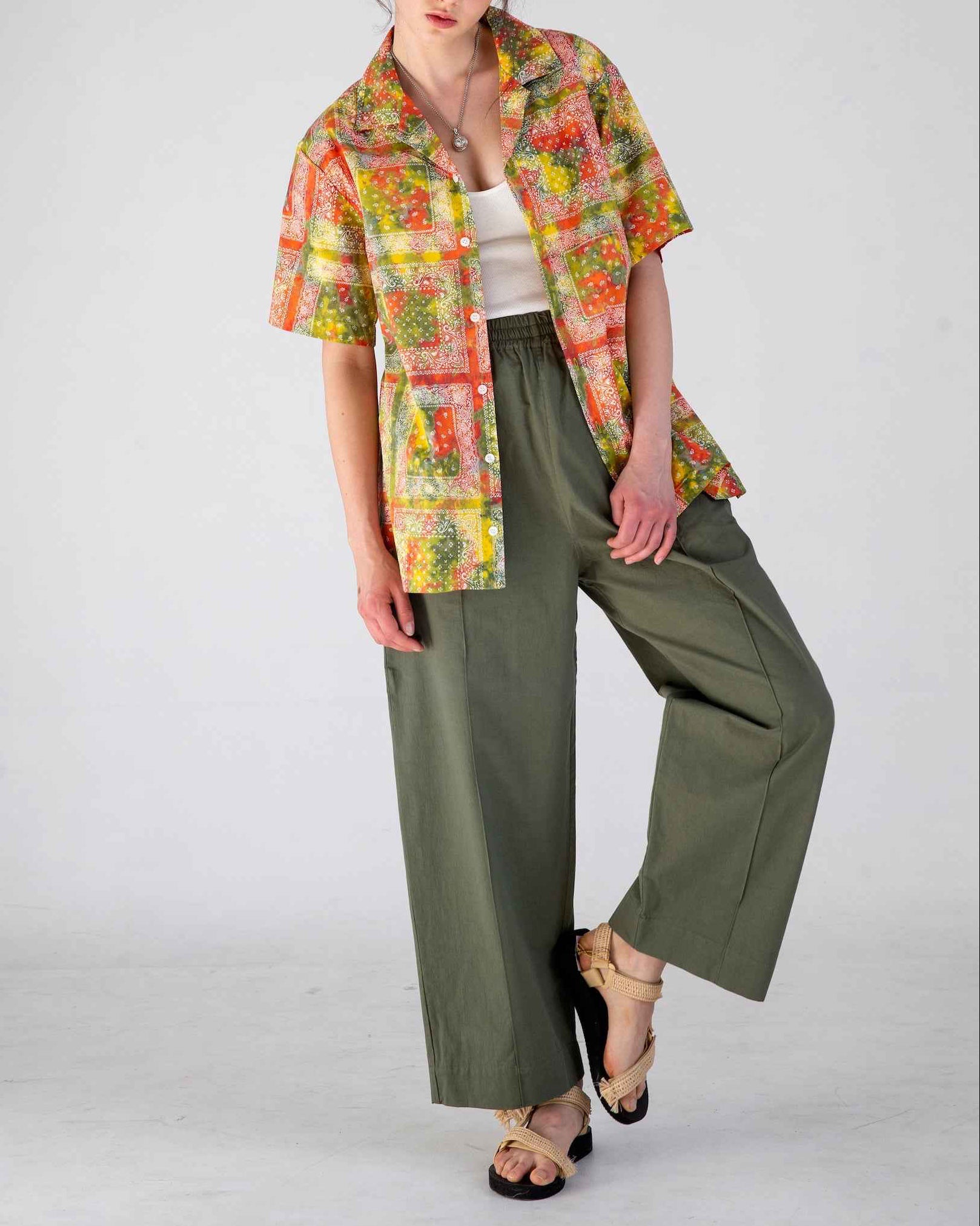 Desi short sleeve camp collar shirt in red batik bandana print, organic cotton poplin, relaxed fit with side slits.