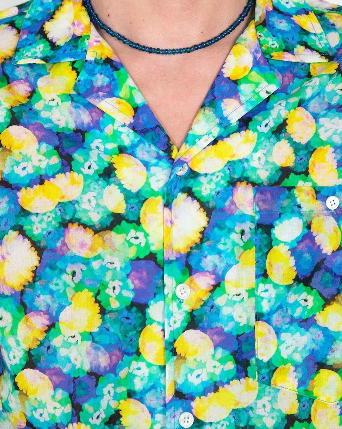 Arenas camp collar shirt in blue floral dream print, relaxed fit, worn by model in three-quarter pose showing soft cotton tencel fabric drape.