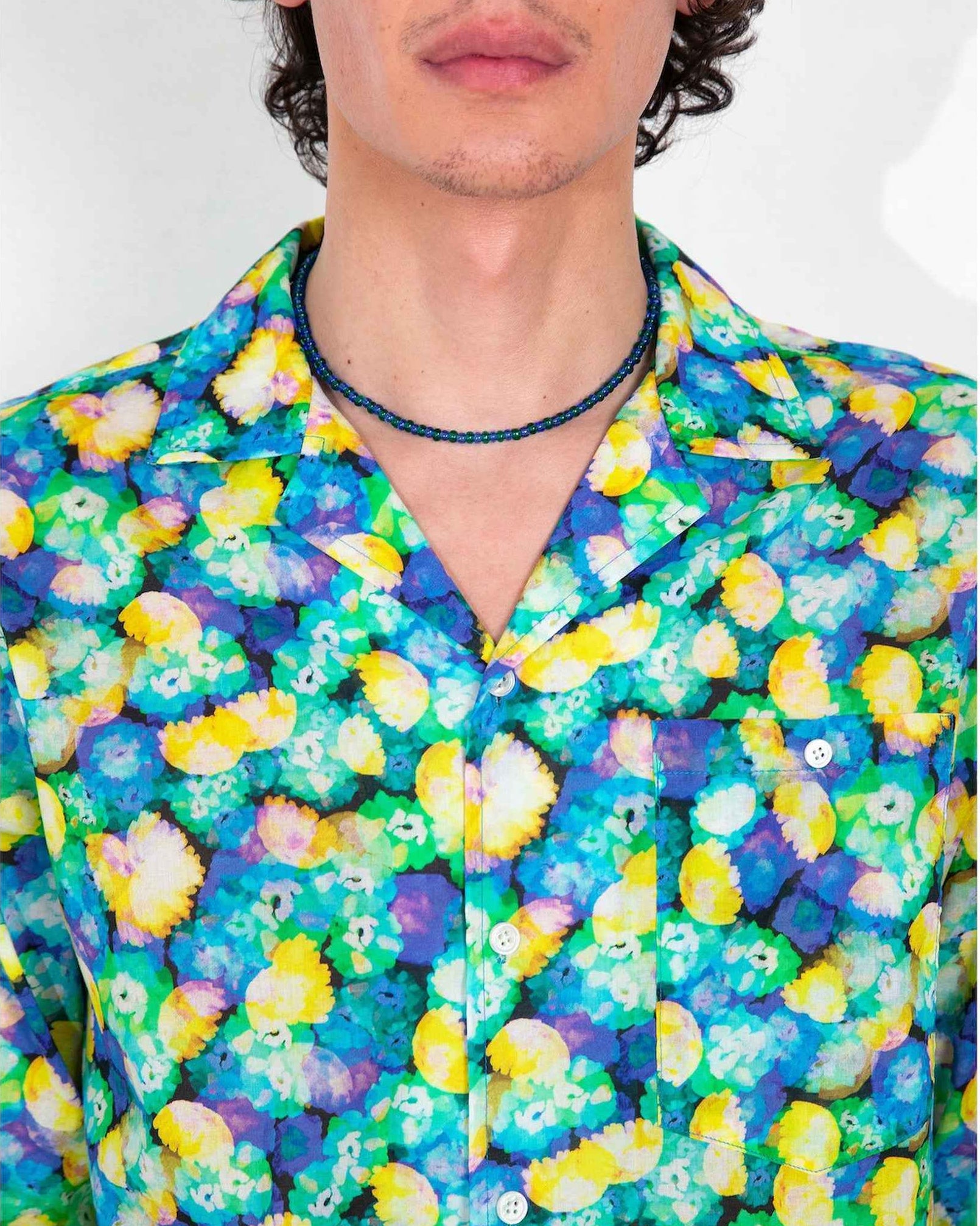 Arenas camp collar shirt in blue floral dream print, relaxed fit, worn by model in three-quarter pose showing soft cotton tencel fabric drape.