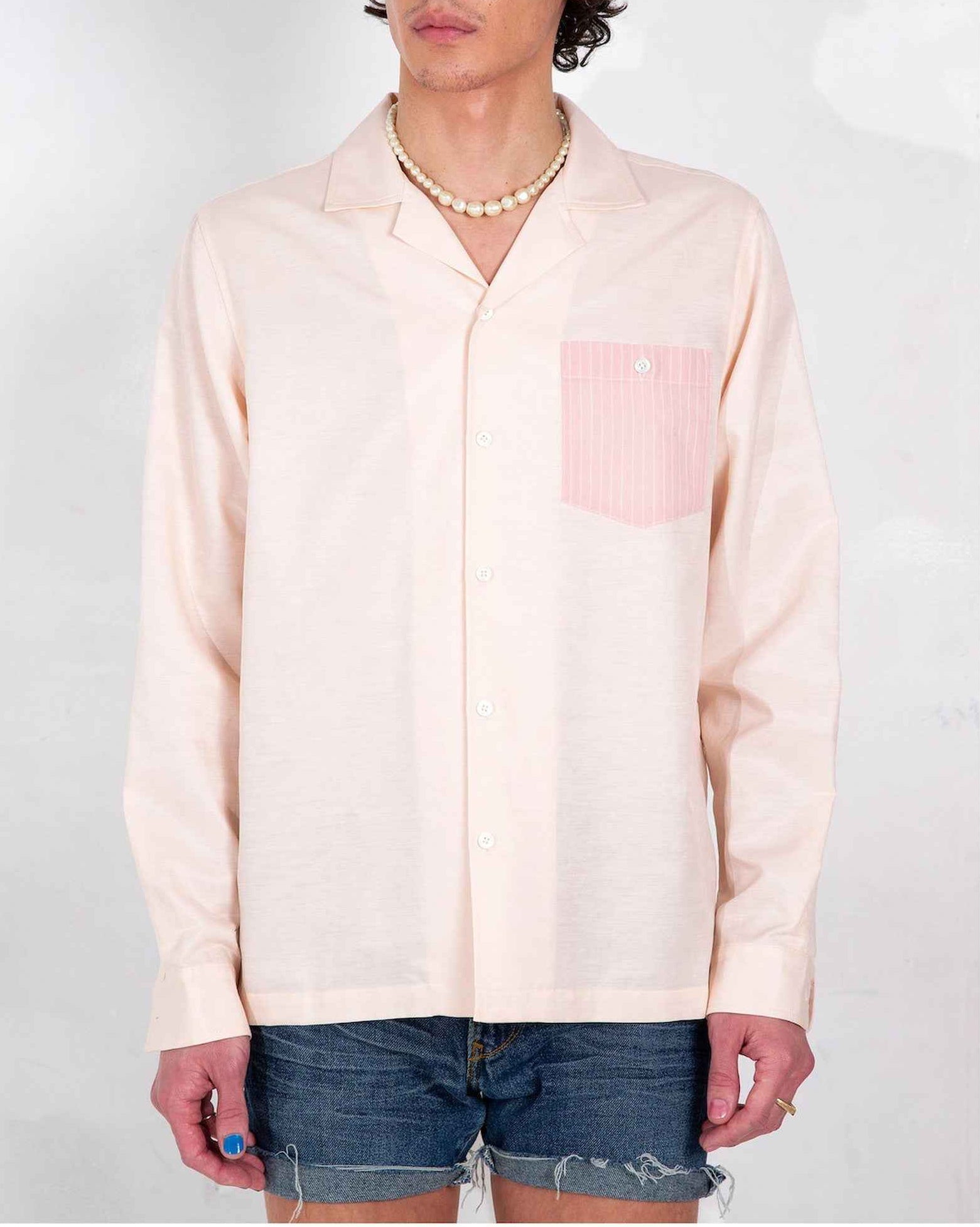 Arenas convertible-collar shirt in blush and white stripe cotton linen cupro twill, relaxed fit, displayed on model from chest up.