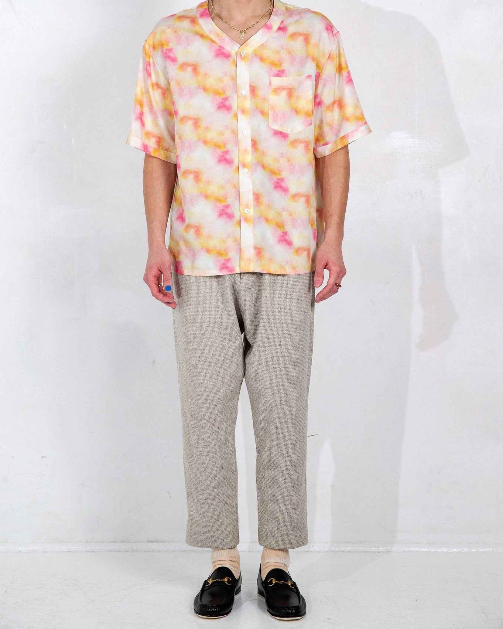 Valenzuela baseball collar shirt in red Dream Pop print, relaxed boxy fit with side slits, displayed on model.