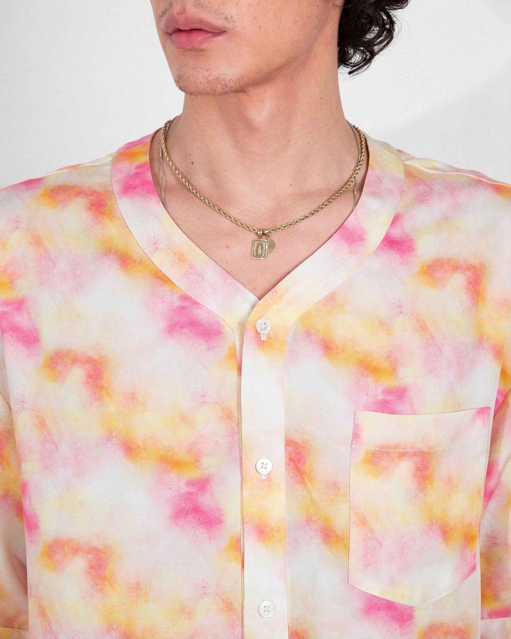 Valenzuela red dream pop print baseball collar shirt on model, relaxed boxy fit with side slits, soft Tencel fabric.